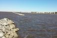 Rocky breakwaters lie just above the water's surface at Louisiana's Cypremort State Park.