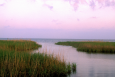 A purplish sky over a marshy waterway in coastal Texas. 