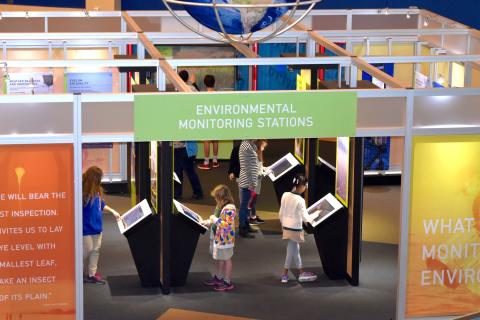 Children learning about environmental monitoring at a new exhibit at the Infinity Science Center.